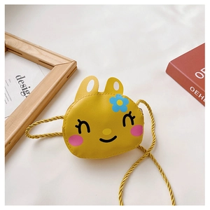 Detail of yellow cartoon bunny kid shoulder bag with cute rabbit ears and blue flower