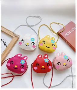Detailed flat lay of cute rabbit crossbody bags for kids in five vibrant colors