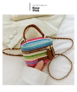 Detail of colorful rainbow knit crossbody bag for kids with rose pink stripes and metal chain