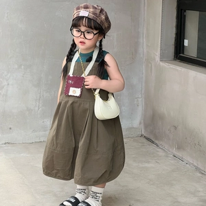 Chic retro brown kids' jumper dress set with green vest and stylish accessories