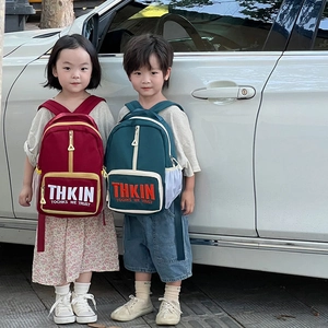 Kids letter printed backpack in red and dark green featuring durable fabric and side mesh pockets