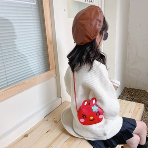 Cute red cartoon bunny crossbody bag for kids with smiling face and flower accents