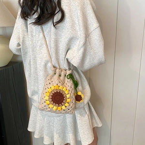 Handmade crochet sunflower drawstring bucket bag for women with floral knit patterns