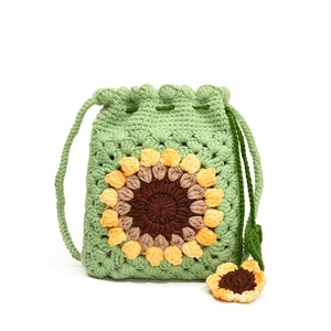 Handmade crochet sunflower crossbody bag in green yarn with floral drawstring detail