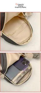 Detail view of the spacious inner compartment and pocket of the cute penguin canvas bag