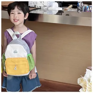 Close-up of kids contrast color backpack with yellow pocket and nylon texture