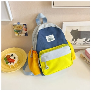 Detail view of colorful TOCHASO kids backpack with Let's Go Camping logo and durable nylon