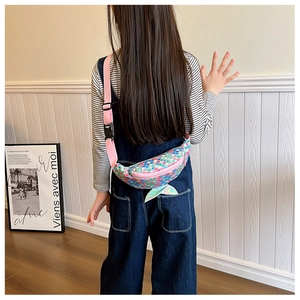 Detail of pink sequin mermaid tail kids fanny pack with adjustable strap on model