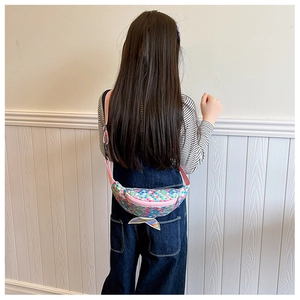 Detailed view of kids mermaid fanny pack featuring iridescent sequins and a silver fish tail