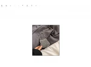 Mini rhinestone crossbody bag with metal frame closure and 20cm scale reference