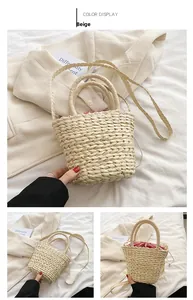 Detail of beige straw bucket bag featuring rope weave texture and striped inner pouch