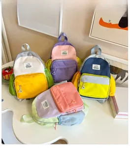 Close-up of four colorful kids backpacks with contrast stitching and side pockets