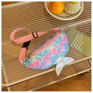 Close-up of sequined mermaid tail fanny pack with gradient scales and adjustable pink strap