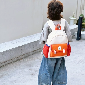 Sac à dos coloré pour enfants avec motifs patchwork bleu et orange pour l'école