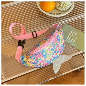 Detail of mermaid waist bag featuring colorful scale texture and holographic fin