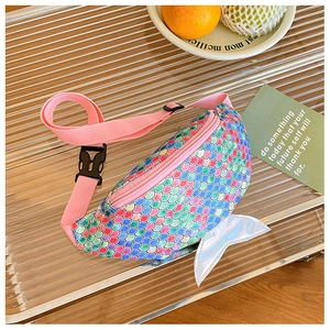 Detail of sequined mermaid tail fanny pack with adjustable strap and laser finish fin