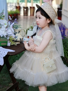 Detail view of the layered tulle dress with decorative pearl bag for flower girls