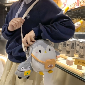 Cute penguin shaped kids crossbody bag in grey with orange pocket and plush pendant