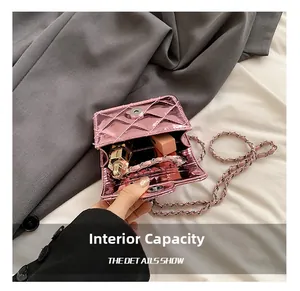 Macro shot showing internal capacity of pink quilted patent leather mini chain bag