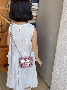 Pink metallic quilted crossbody bag for kids with chain strap and silver floral buckle