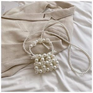 Handcrafted pearl bead handbag with crossbody chain strap for elegant styling