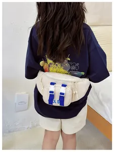 Rear view of kid wearing a cream-white nylon waist bag with blue contrast straps and buckle