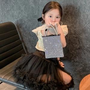 Fashionable mini chain handbag for kids featuring sparkly silver rhinestones and dual handles