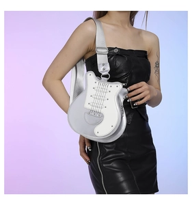 Detailed view of creative silver guitar-shaped shoulder bag with metallic finish and wide strap
