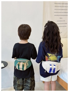 Detail view of stylish kids chest bag with contrasting colors and adjustable buckles