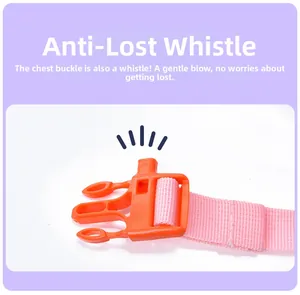 Detail of pink chest strap with orange anti-lost buckle and built-in safety whistle