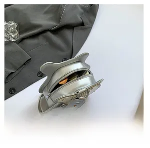 Silver cat ear crossbody bag detail showing interior capacity and nylon shoulder strap