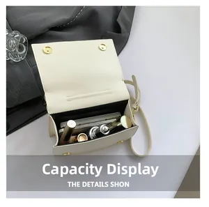 Capacity display of the cream flap crossbody bag showing phone and cosmetics inside