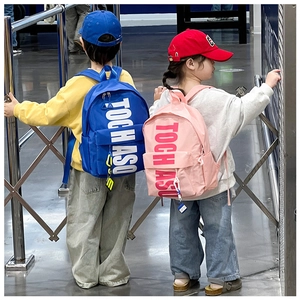 Side view of large capacity kids backpacks in blue and pink with TOCH ASO letter prints