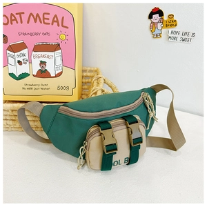 Detail of color-block kids waist bag with dual buckle closure and nylon webbing strap