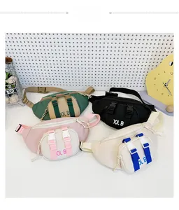 Still life display of four trendy kids chest bags in assorted colors with buckle detail