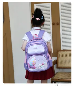 Rear view of purple school bag with 3D butterfly wings and floral embroidery on a girl