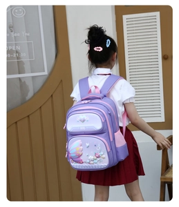 Girl wearing purple butterfly school backpack with side mesh pockets and adjustable straps