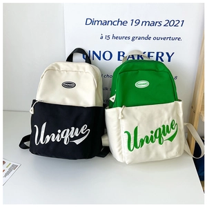 Detail of canvas backpacks with Unique embroidery and front pockets for kids