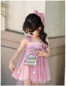 Detail view of pink layered mesh tutu dress for kids featuring a sweet ruffled skirt