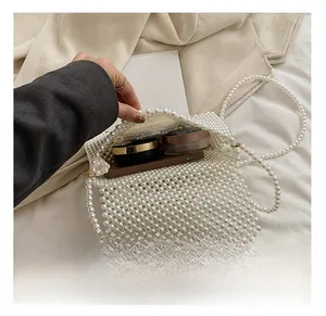 Detail showing internal capacity of handmade pearl woven bag with soft lining