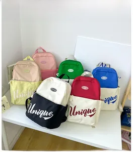 Close-up of canvas school backpack with contrast colors and Unique embroidered lettering