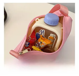 Pink semi-circular crossbody bag showing internal capacity with wide fabric strap