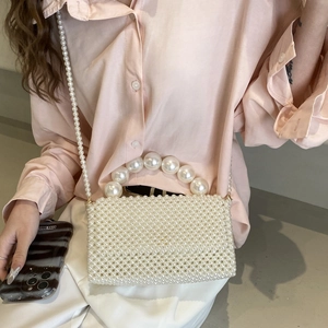 Elegant woven pearl handbag for women with large bead handle and crossbody chain strap
