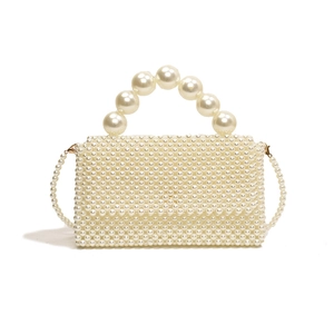 Elegant woven pearl handbag for women with arch handle and long shoulder strap