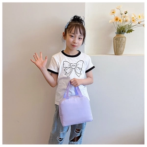 Detail of light purple canvas lunch tote bag with zipper closure held by child