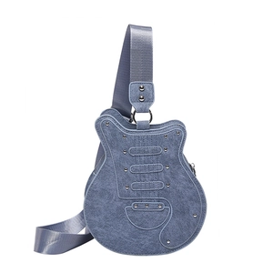 Unique blue denim guitar-shaped crossbody bag featuring metallic rivet details