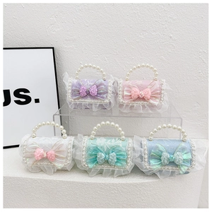 Detailed macro view showing diverse pastel lace crossbody bags with large sequined bows