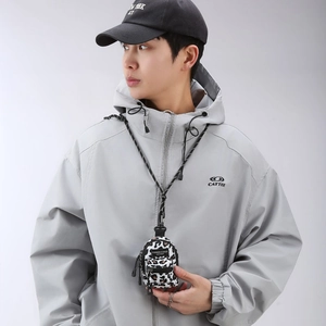 Mini leopard print crossbody bag styled with a grey hoodie and black baseball cap