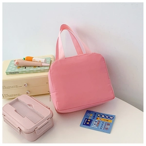 Detailed view of a pink minimalist canvas lunch bag with reinforced dual webbing handles