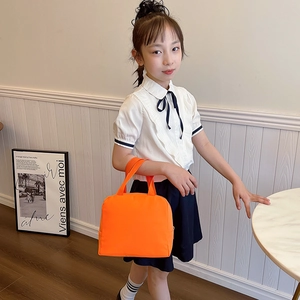 Kids orange canvas lunch tote bag with double handles for school and picnic use